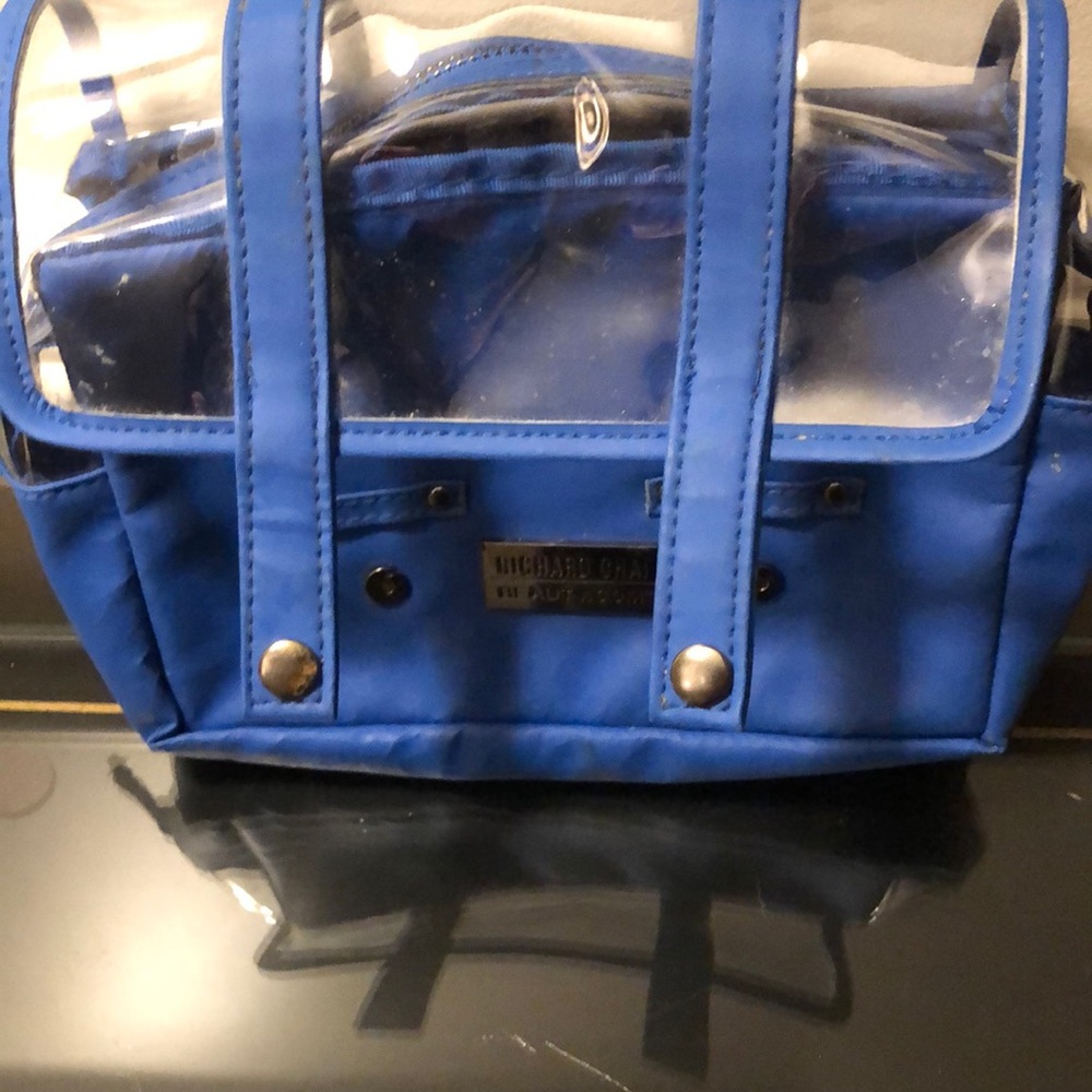 Blue toiletries bag with satin paisley eye mask.